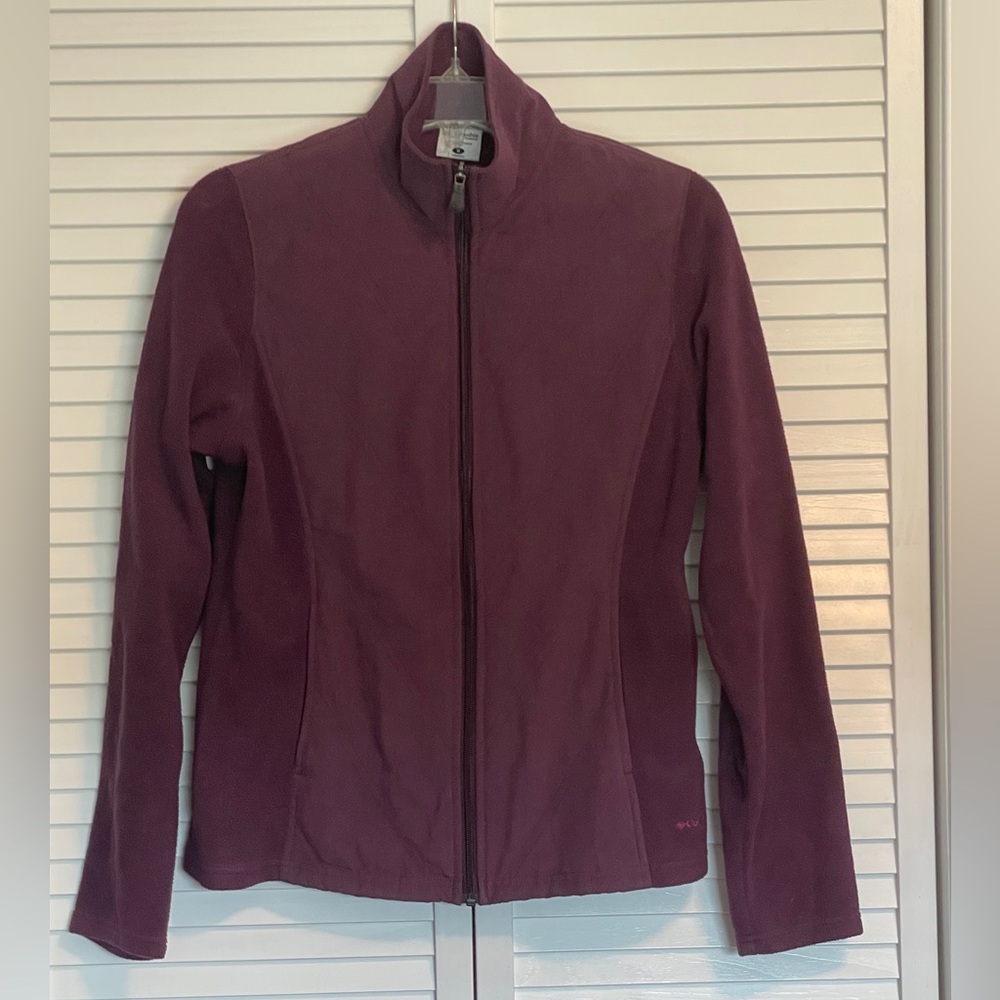 Columbia women’s burgundy color jacket with fleece sides and sleeves. Size small